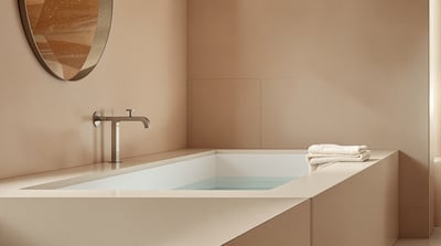 The edge of a bath in a calm bathroom